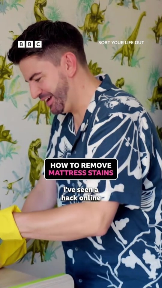 Man demonstrating how to remove mattress stains.