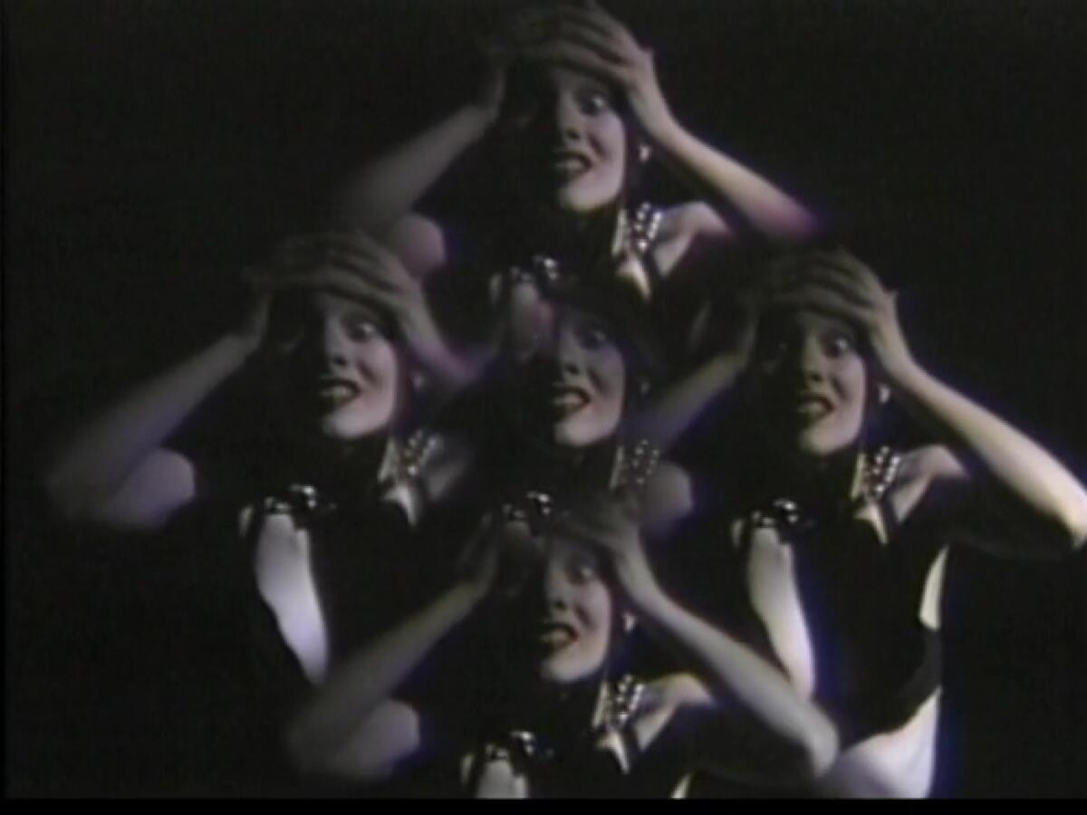 A woman holding her head is refracted into multiple images.