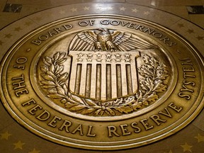 FILE - The seal of the Board of Governors of the United States Federal Reserve System is displayed in the ground at the Marriner S. Eccles Federal Reserve Board Building in Washington, Feb. 5, 2018.