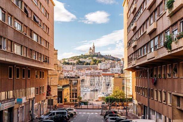 Vieux Port old port and Notre Dame de La Garde basilica on the hill, Marseille, France