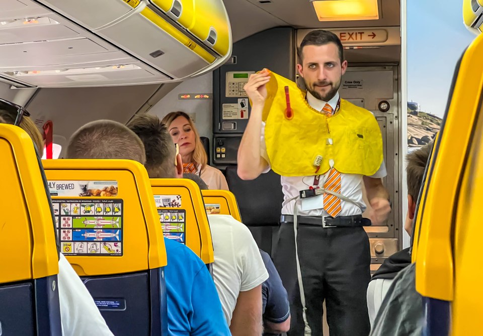 Safety training on a Ryanair Boeing 737-800 based on instructions on the plane's seat and instruction by a steward