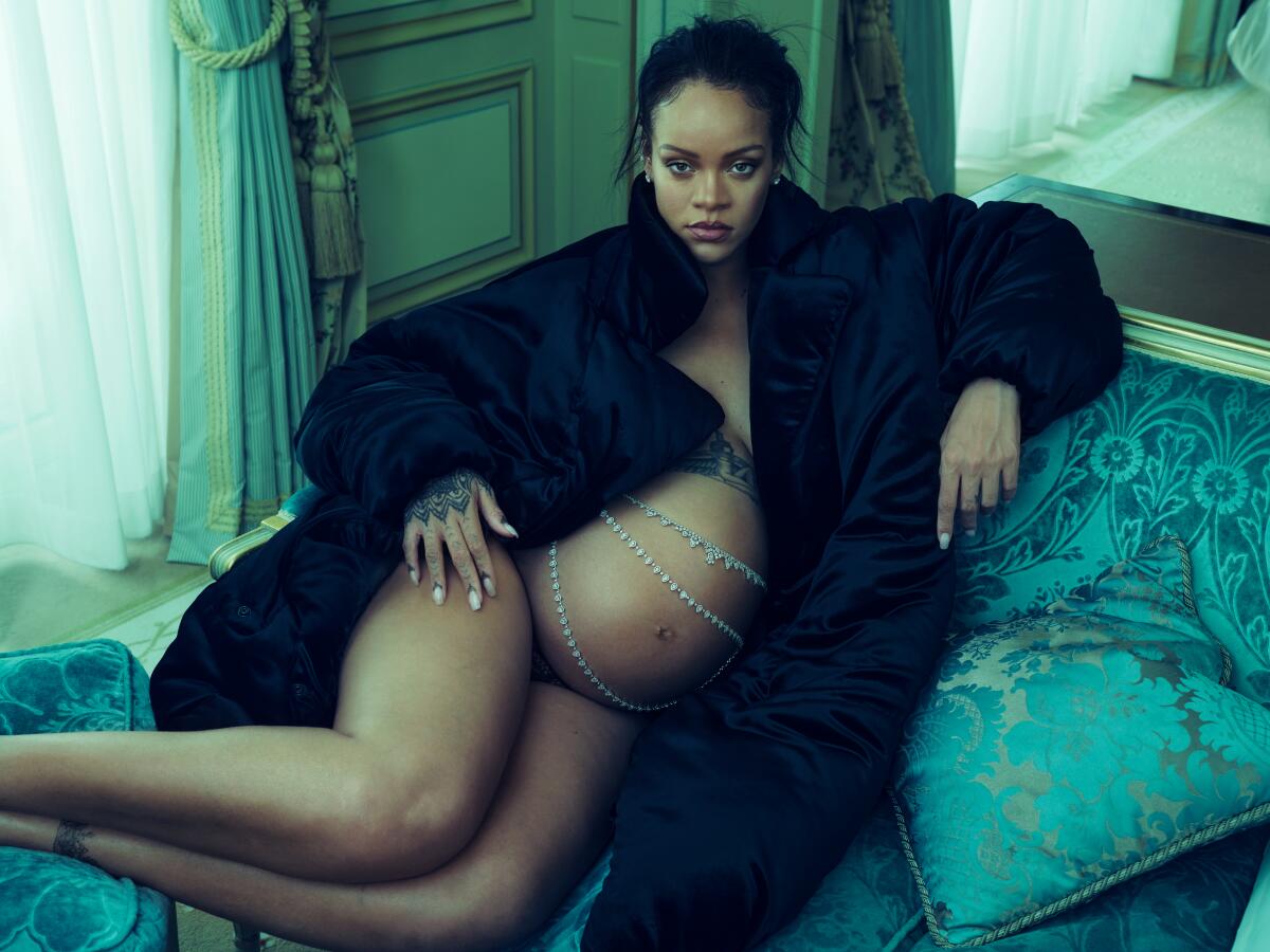 A pregnant Rihanna draped in jewels and fur. 