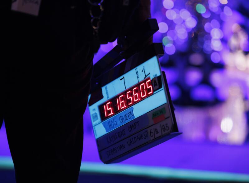 The slate lights up with a digital time code.
