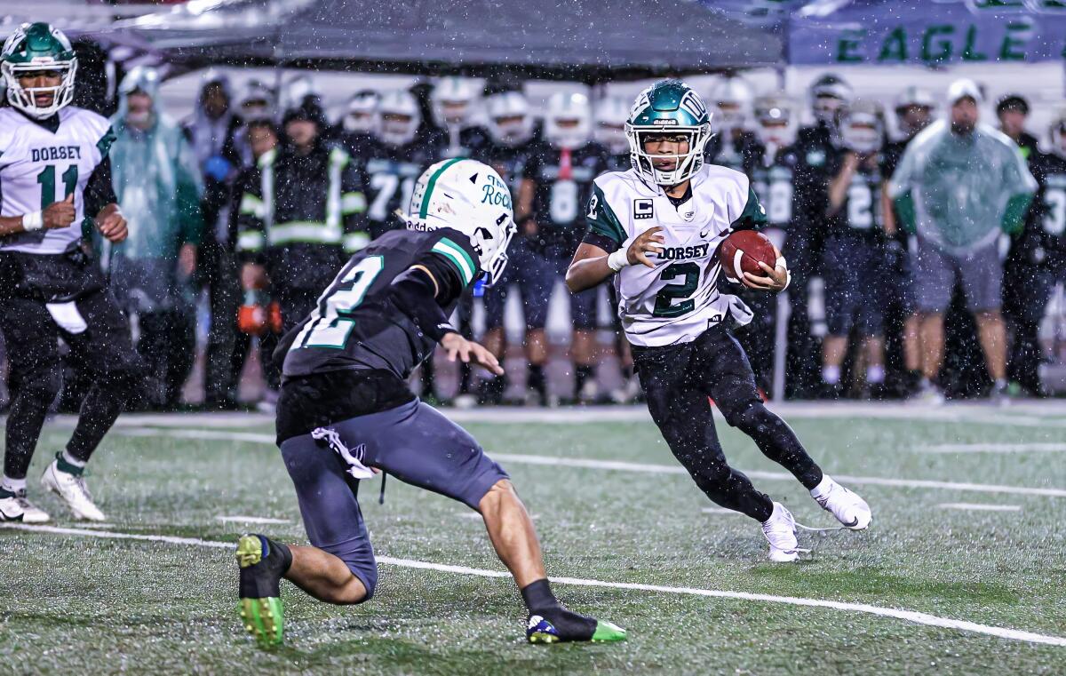Dorsey wide receiver Stafon Johnson runs with the ball against Eagle Rock.