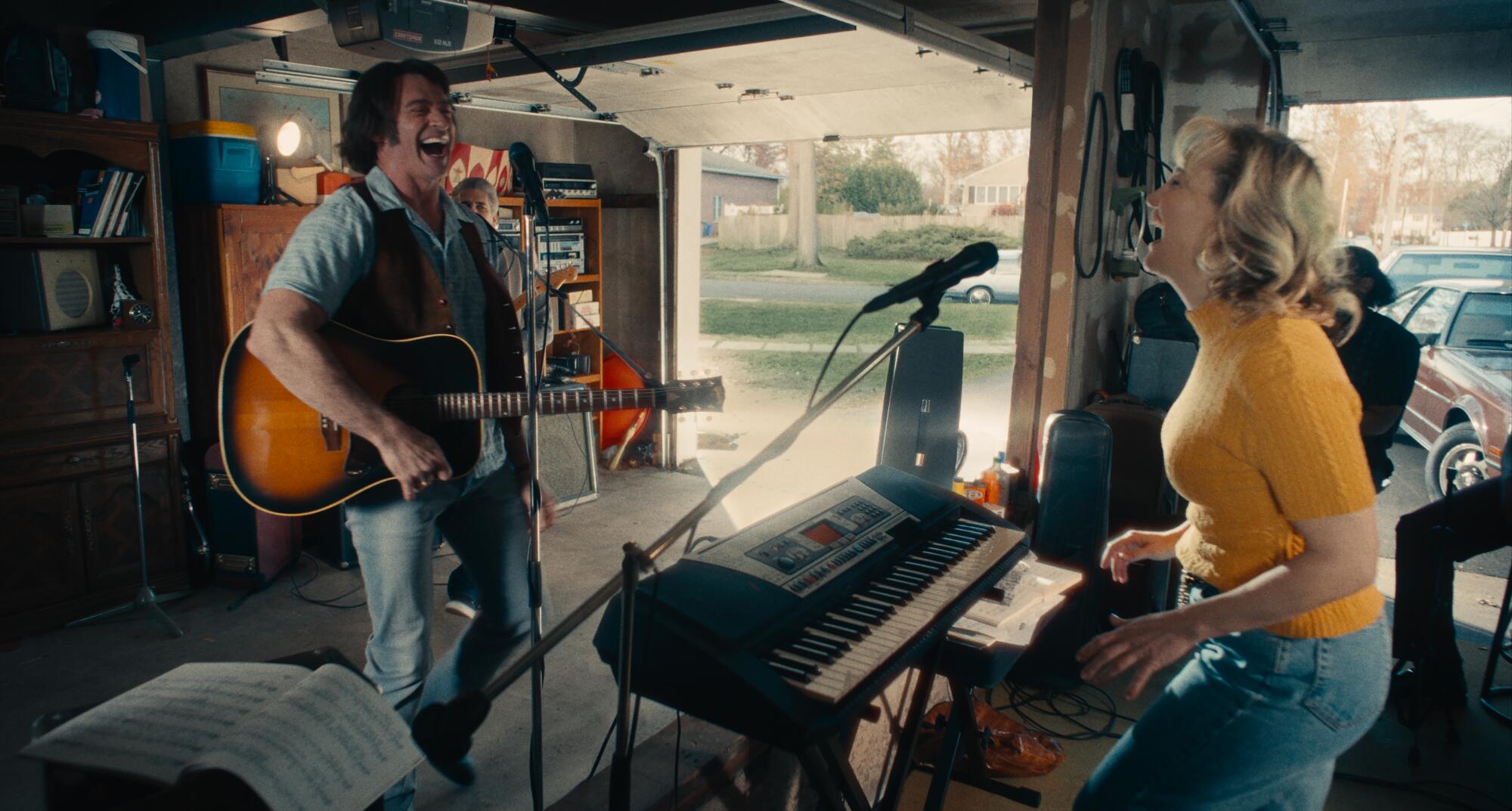 A man and a woman rehearse music in a garage.