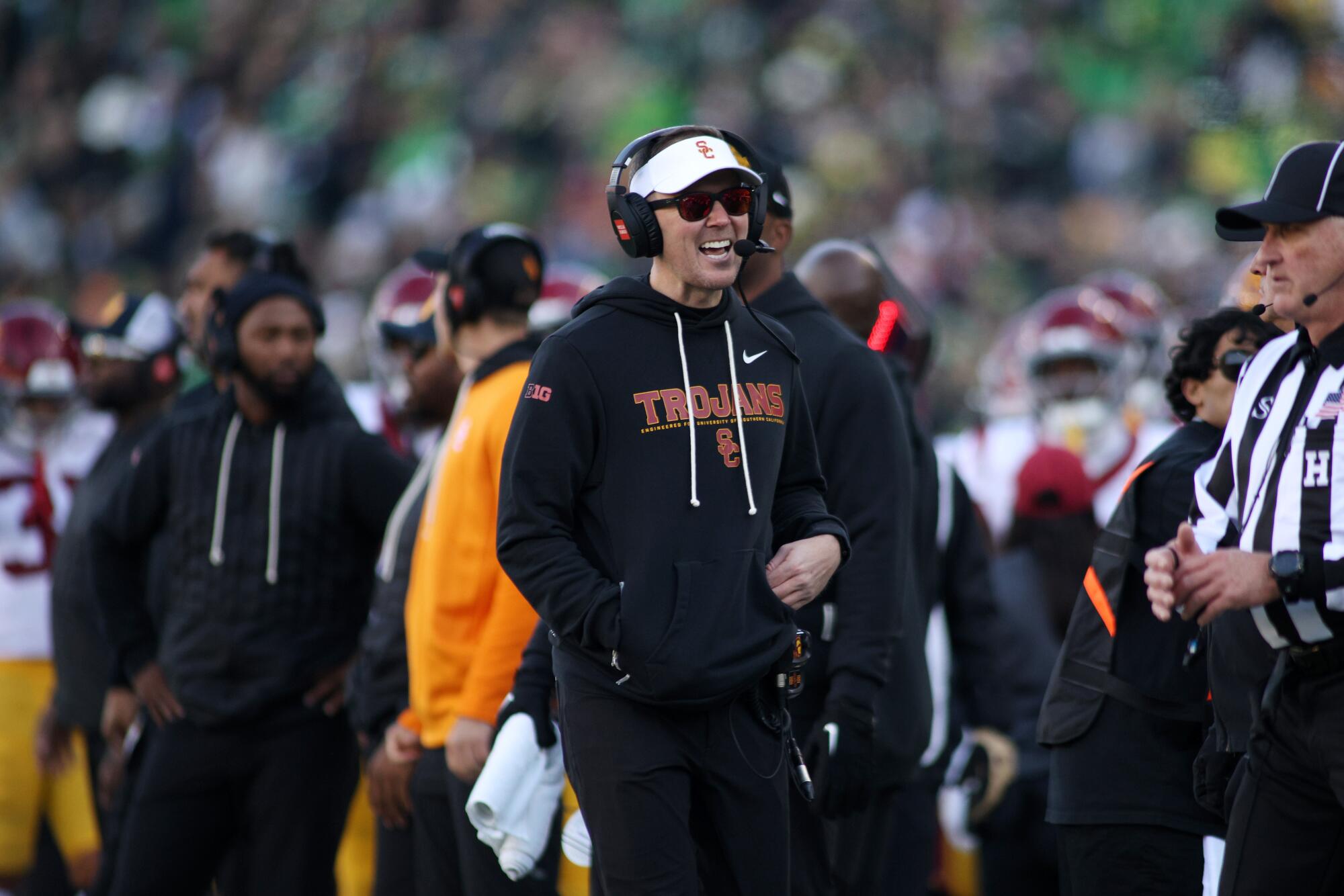 USC coach Lincoln Riley, center, walks on the sideline during a 42-27 loss to Oregon on Saturday.
