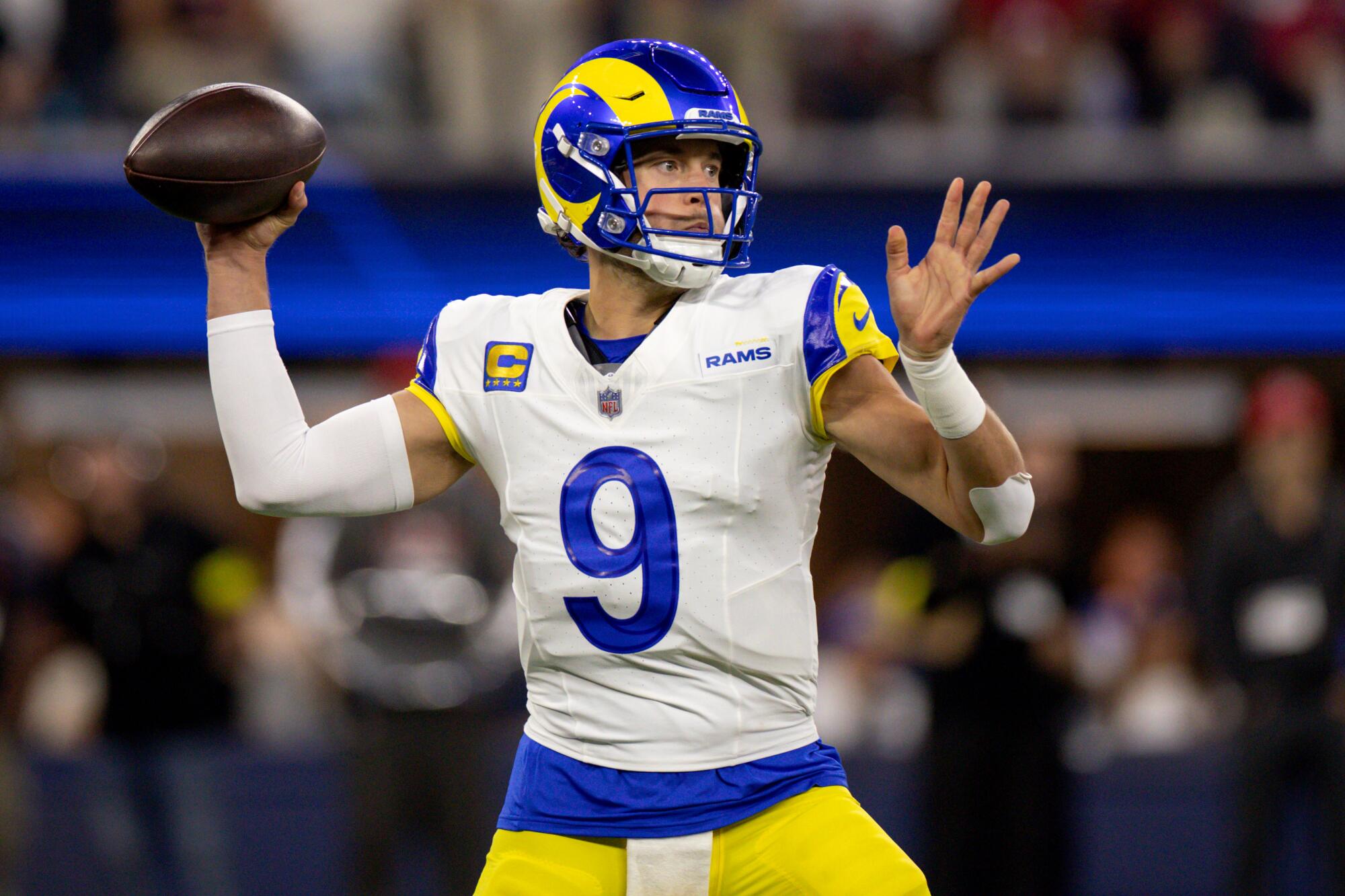 Rams quarterback Matthew Stafford passes the football.