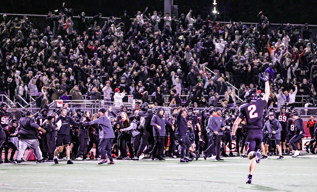 Keawe Browne (2) celebrates after a blocked Mater Dei field-goal attempt gives Corona Centennial 28-27 win.