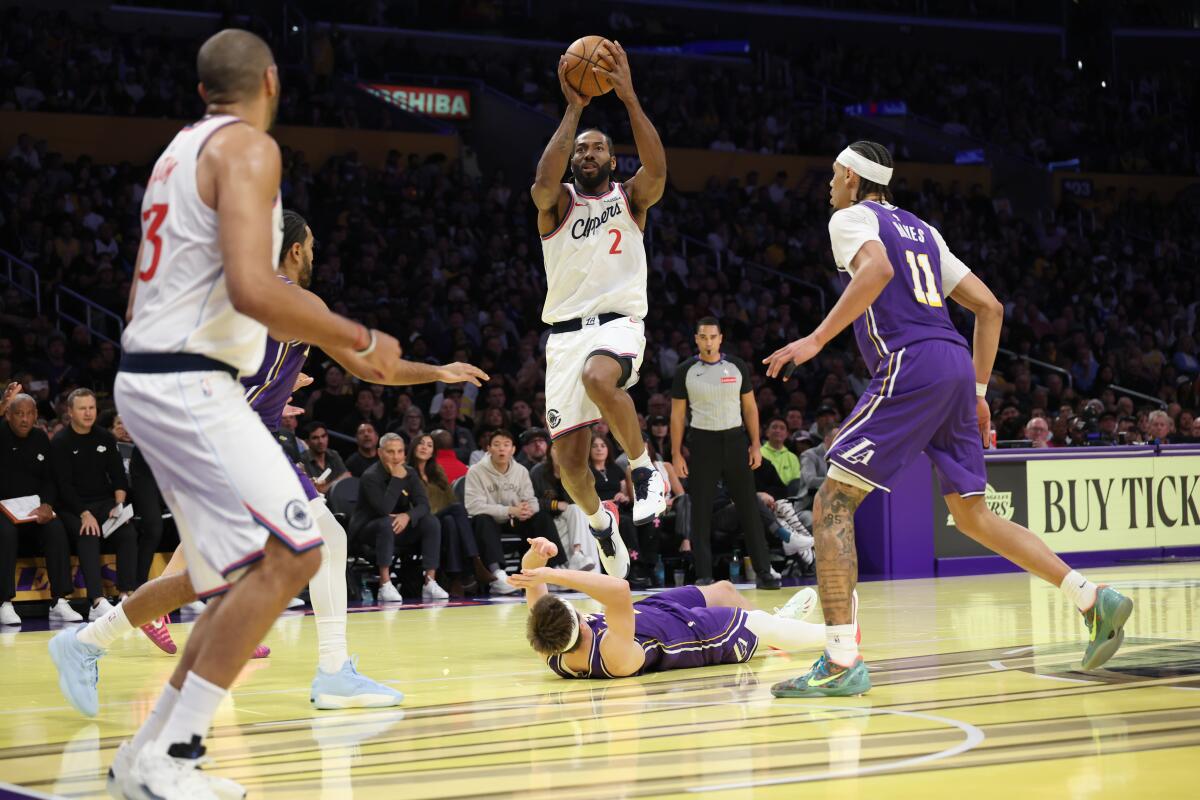 Kawhi Leonard of the Clippers was called for a foul after knocking down Austin Reaves on this play.