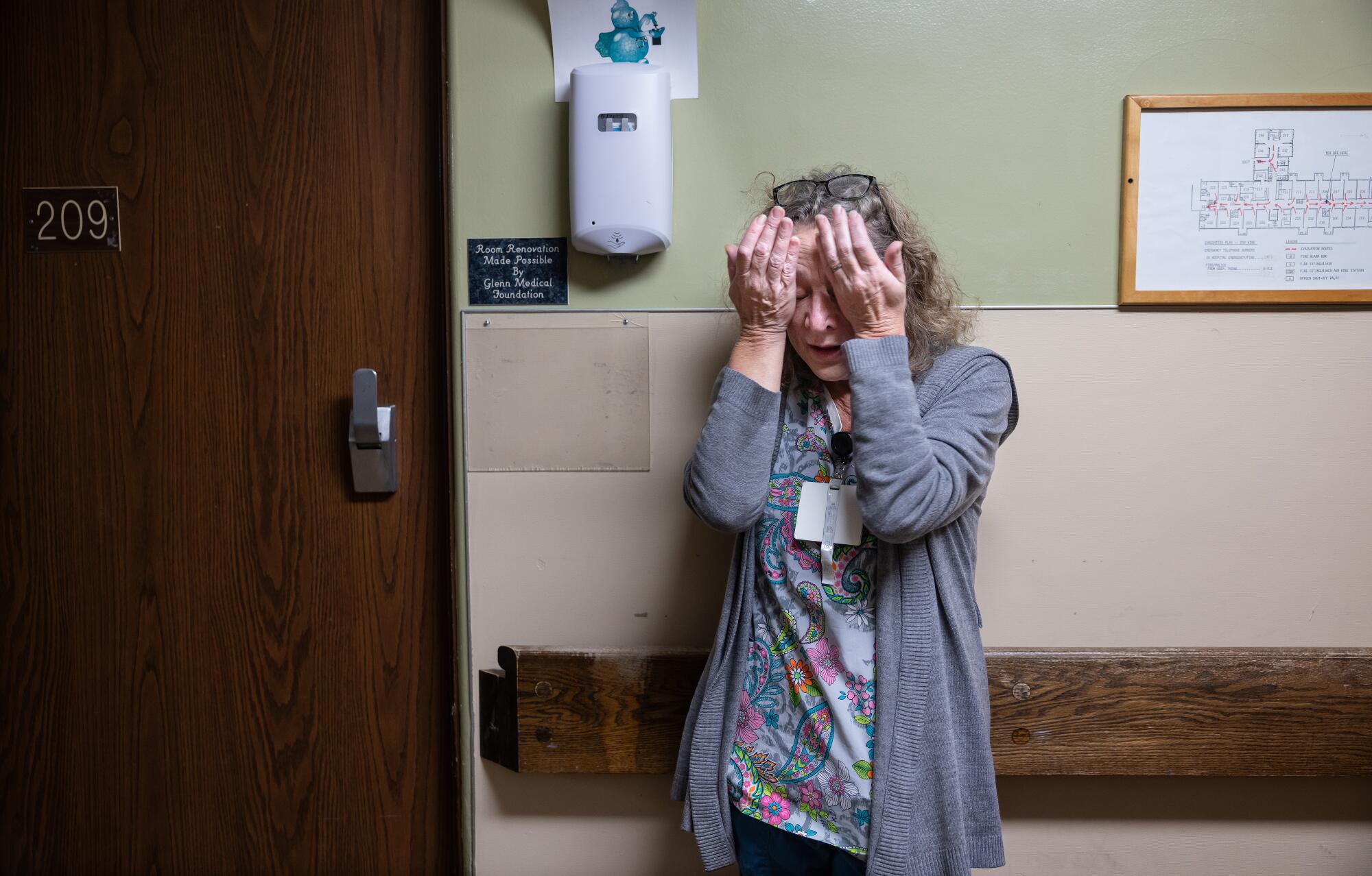 A woman with her head in her hands 