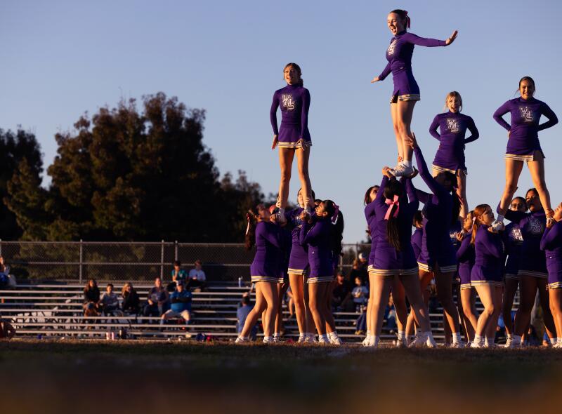 Cheerleaders perform during Willows High School's Homecoming JV football game