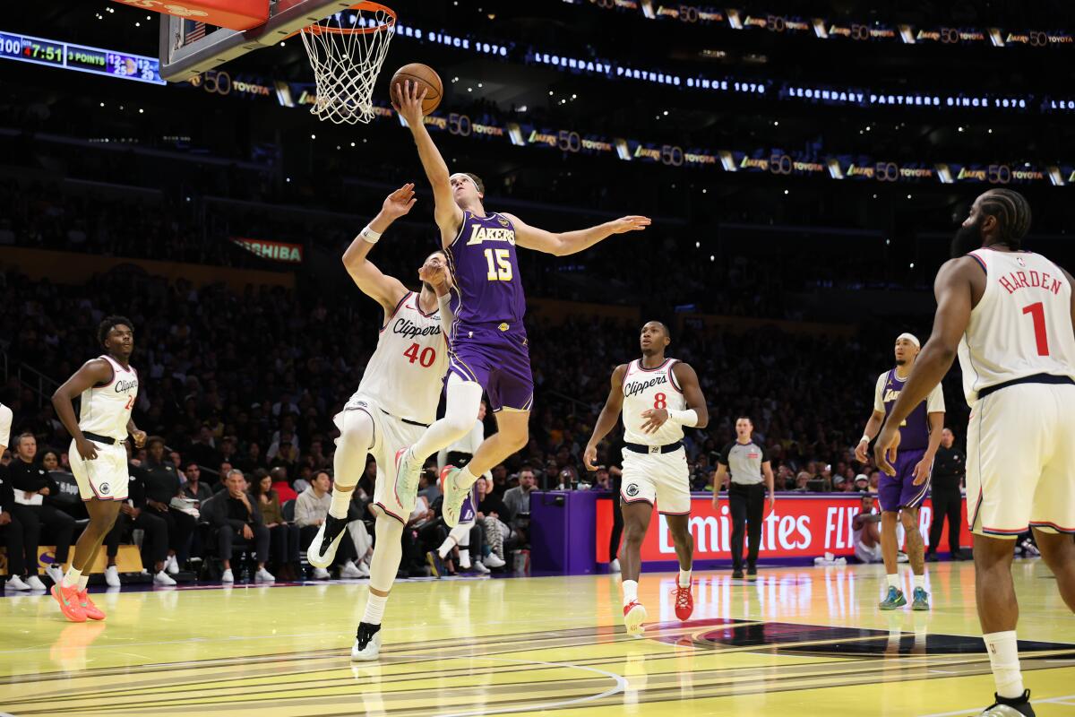 Lakers guard Austin Reaves drives to the hoop as Clippers center Ivica Zubac defends in the second half at Crypto.com Arena.