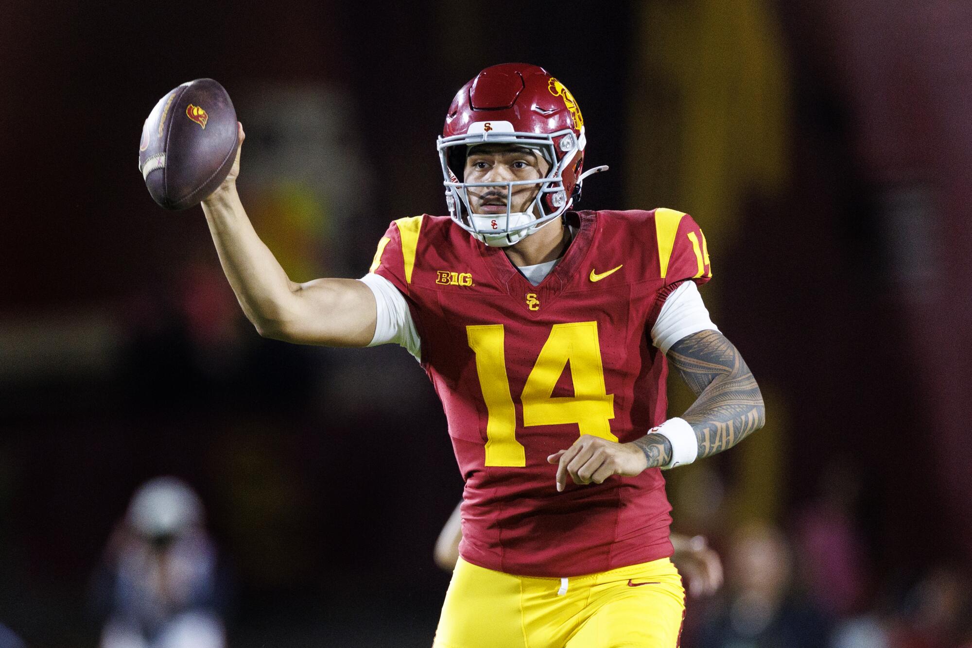 USC quarterback Jayden Maiava holds the football and looks for an open receiver during a win over Michigan.