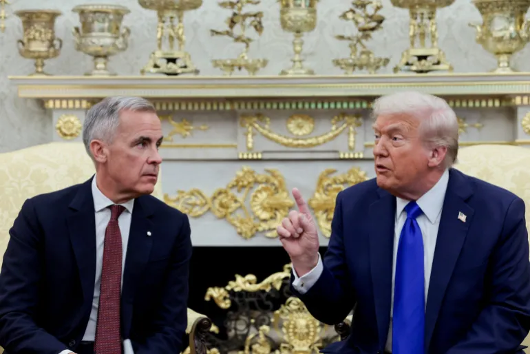 U.S. President Donald Trump gestures as he and Canada's Prime Minister Mark Carney meet in the Oval Office at the White House in Washington, D.C., US, October 7, 2025. REUTERS/Evelyn Hockstein