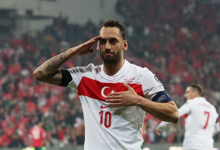 Hakan Calhanoglu reacts.