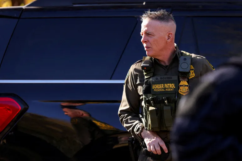 Border Patrol commander Greg Bovino looks on during an immigration raid on the streets of Charlotte
