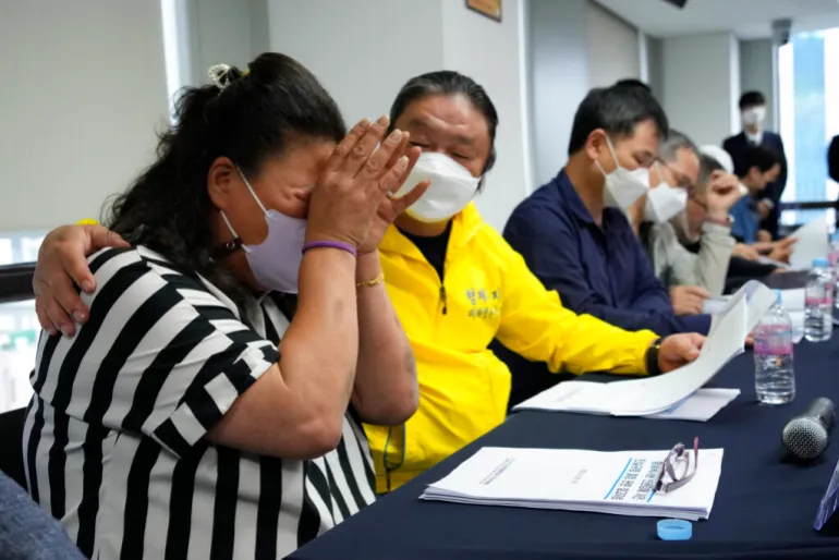 Park Sun-yi, left, a victim of Brothers Home, weeps during a news conference at the Truth and Reconciliation Commission office in Seoul