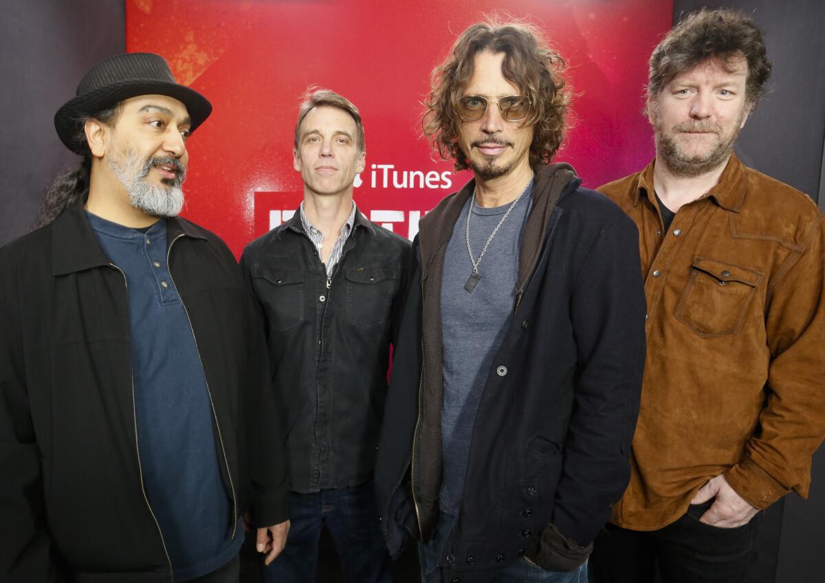 Soundgarden members Kim Thayil, Matt Cameron, Chris Cornell and Ben Shepherd standing in a line, posing for photo  
