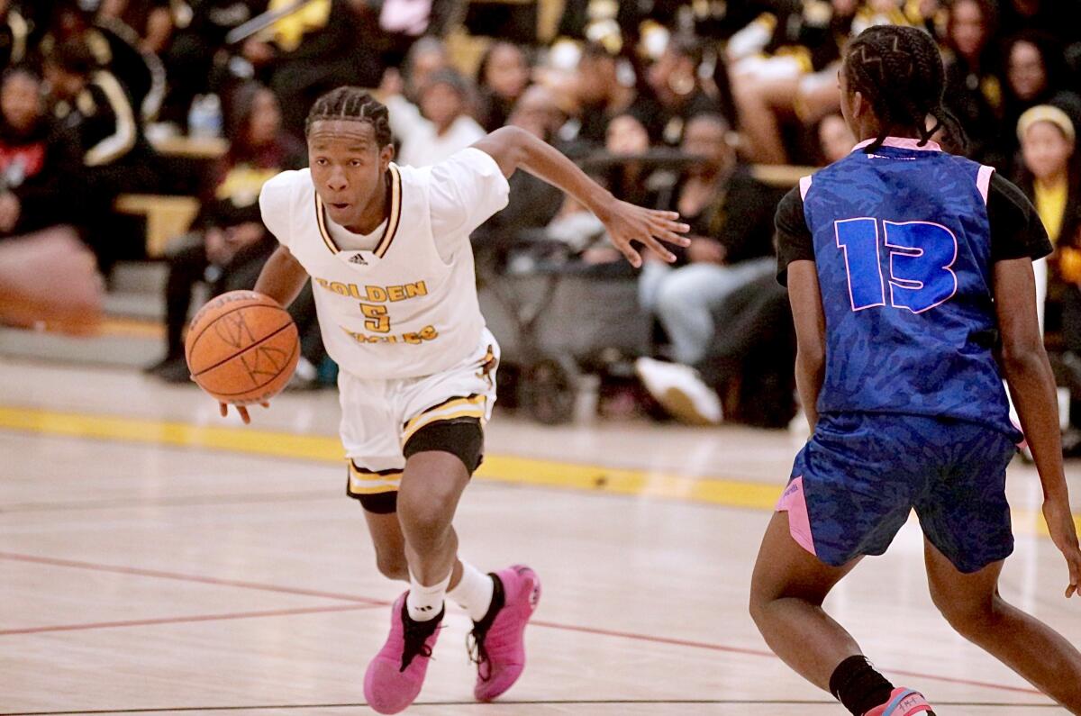 Guard Jayshawn Kibble drives to the basket while playing for King/Drew during a City Section playoff game against Palisades.