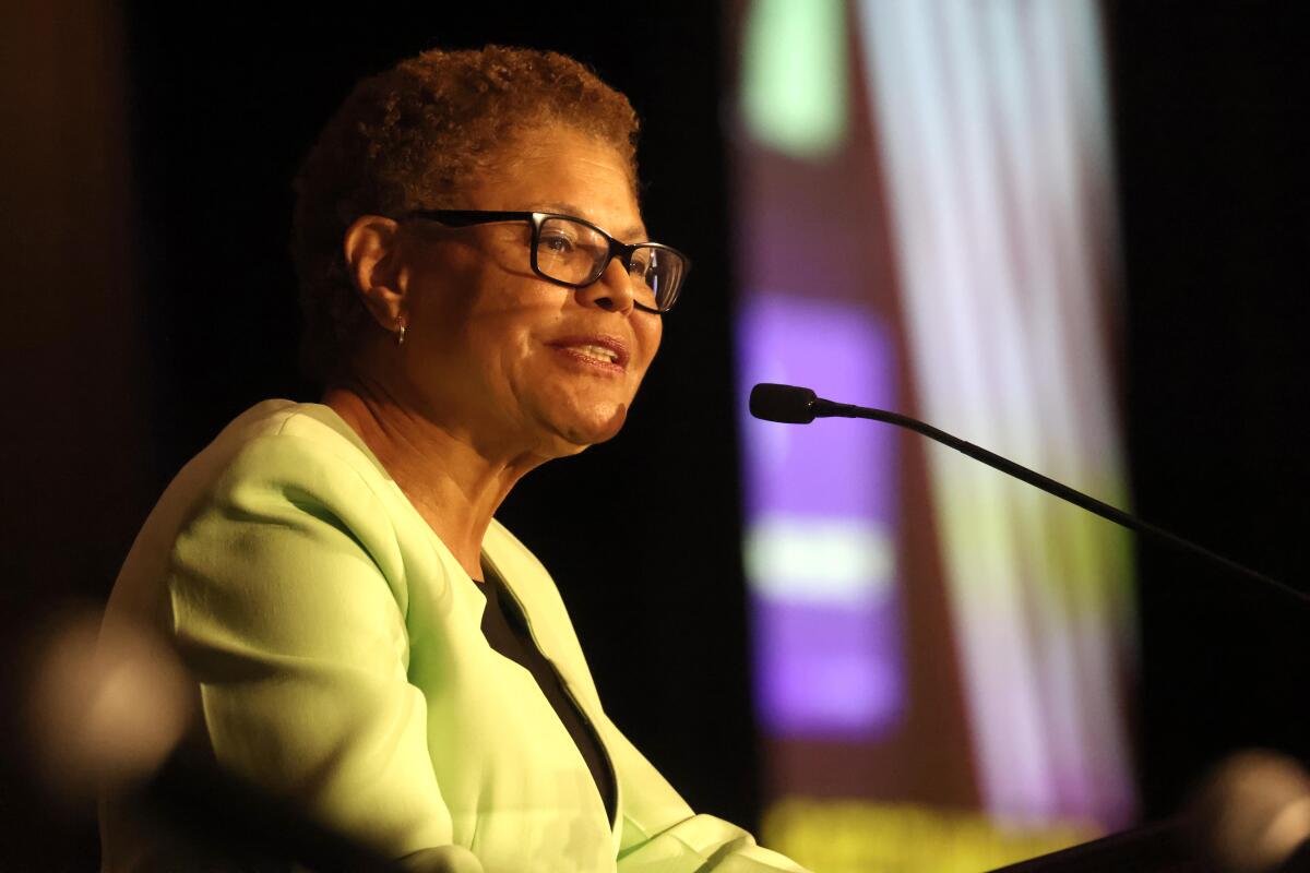 Mayor Karen Bass speaks at a mic