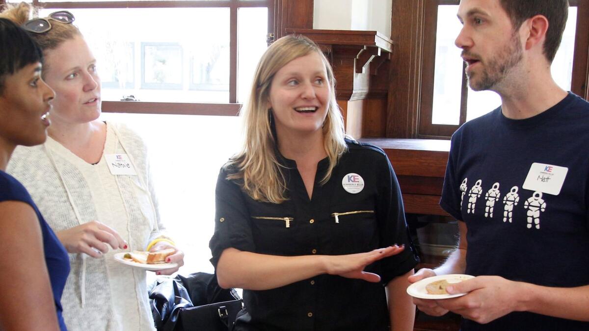 Buffy Wicks, center, who worked in the Obama White House and for the Obama and Hillary Clinton campaigns, is running for the state Assembly.