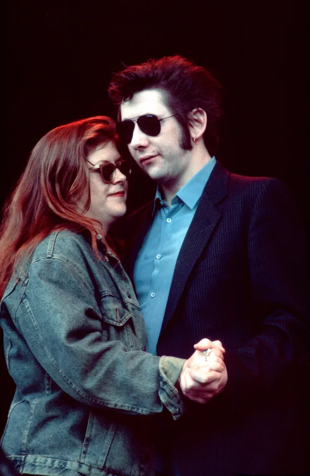 Kirsty MacColl and Shane MacGowan dancing.