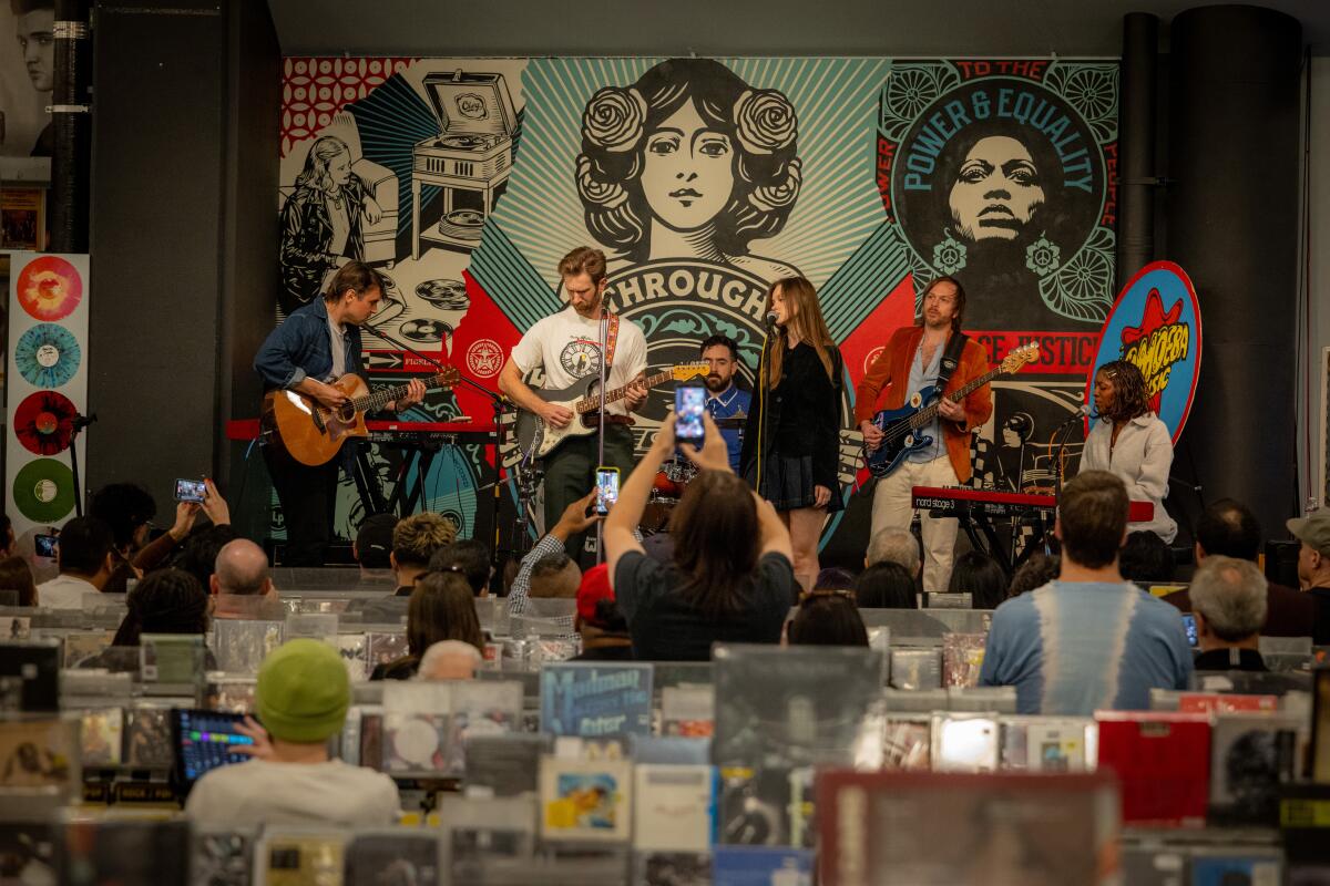 Musicians perform at a record store. 