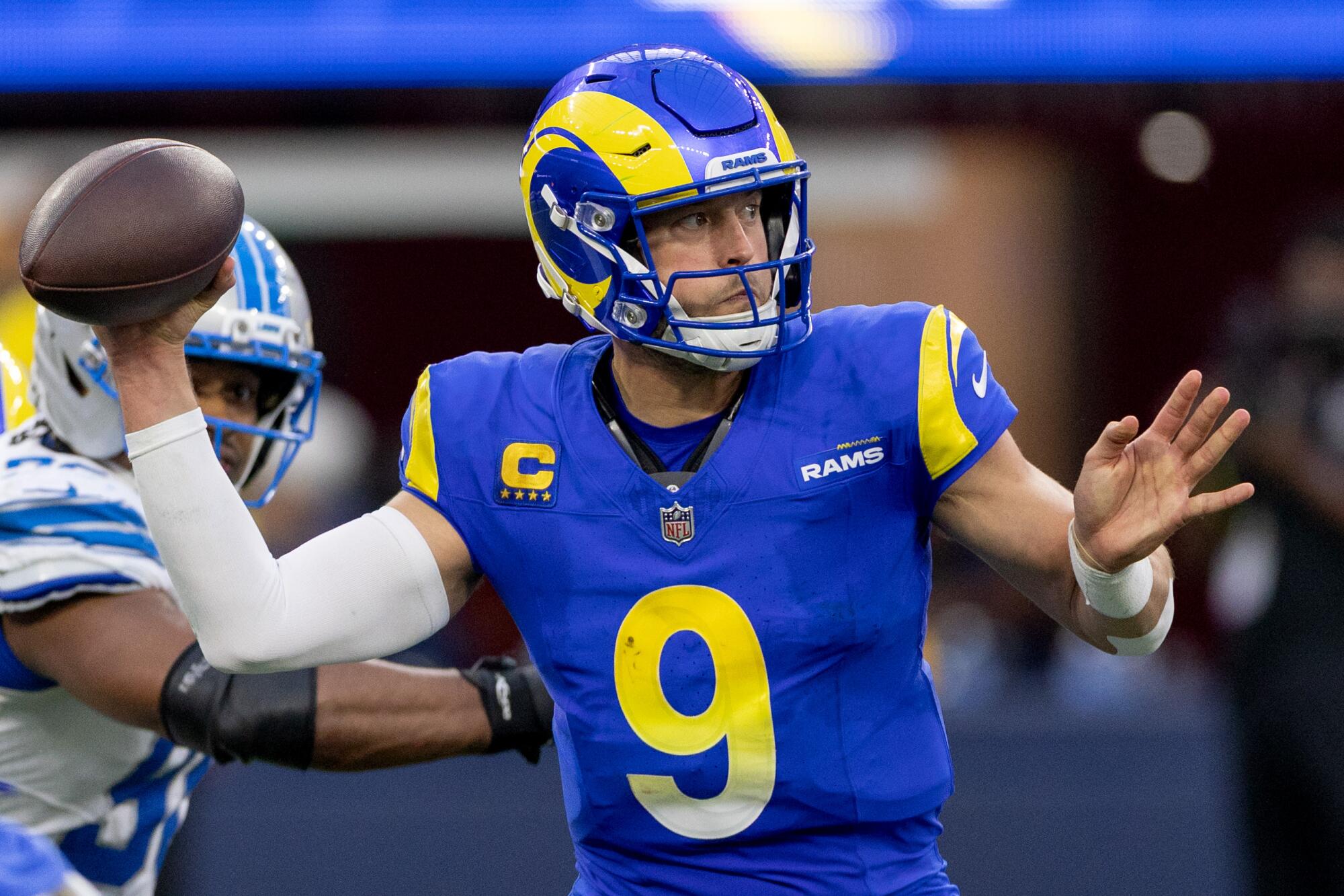 Rams quarterback Matthew Stafford passes in the first half of a 41-34 win over the Detroit Lions at SoFi Stadium on Sunday.