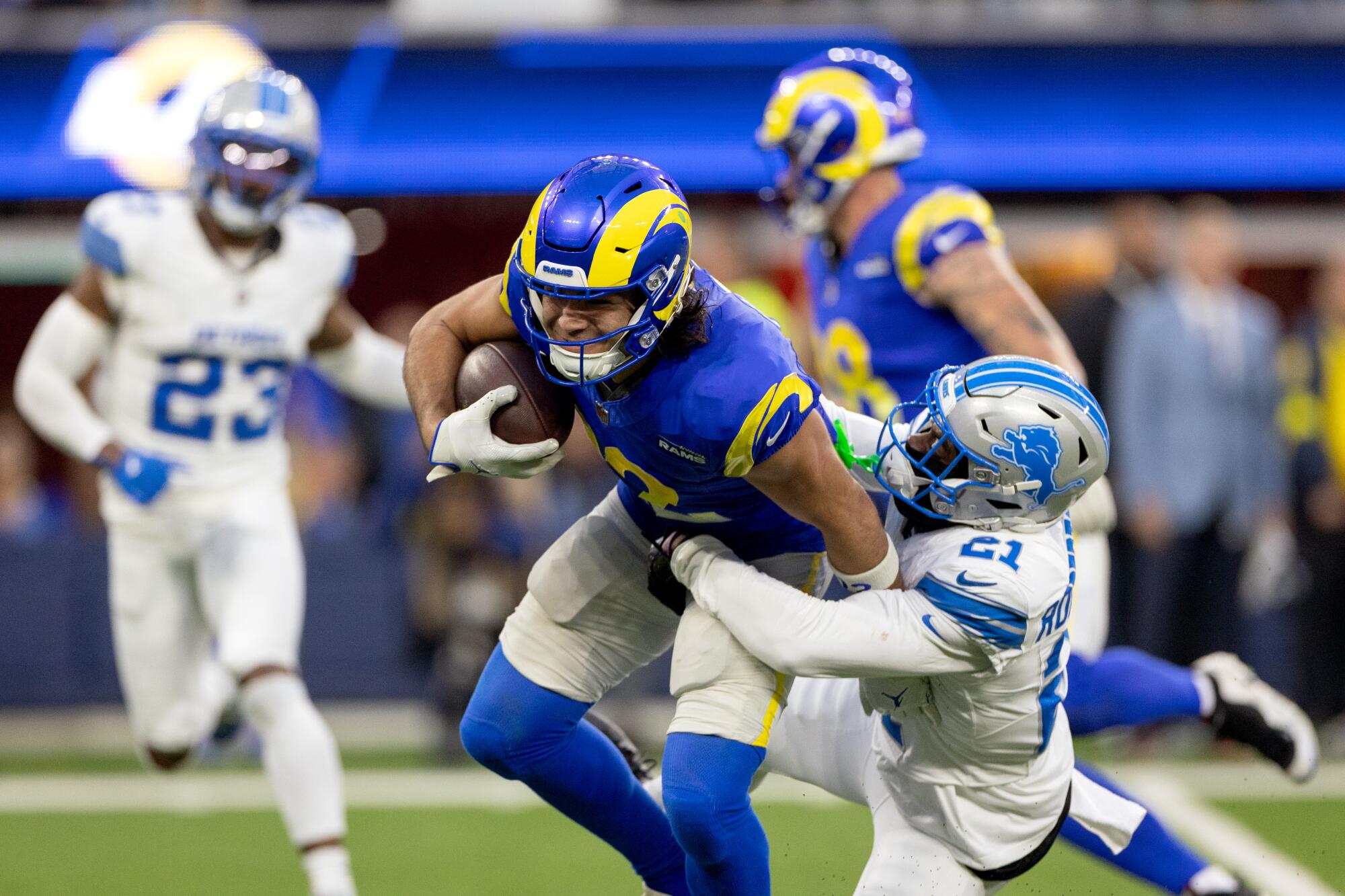Rams wide receiver Puka Nacua is tackled by Detroit cornerback Amik Robertson during the second half Sunday.