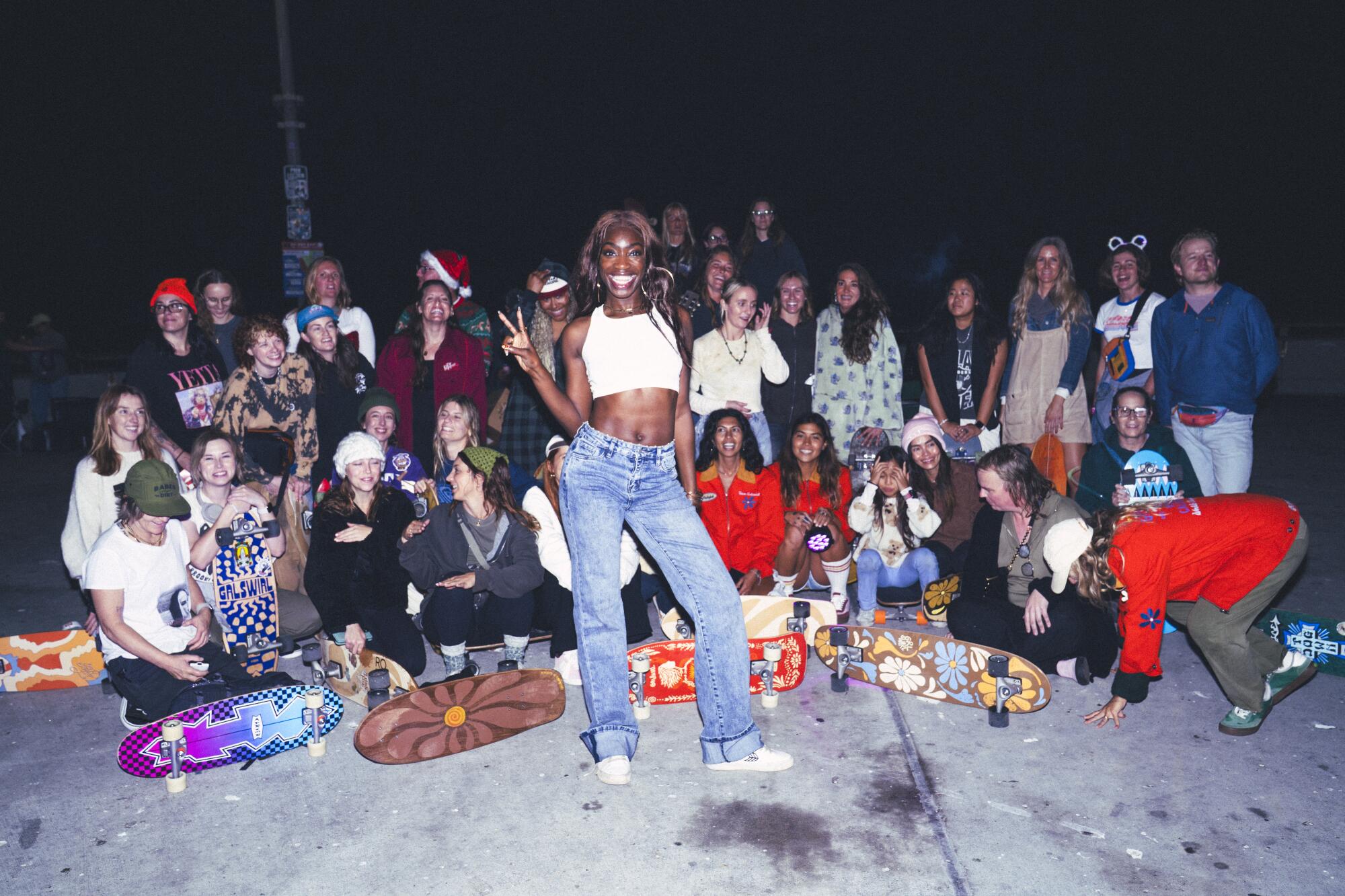 Yaya Ogun, a GrlSwirl team rider, poses with the group.