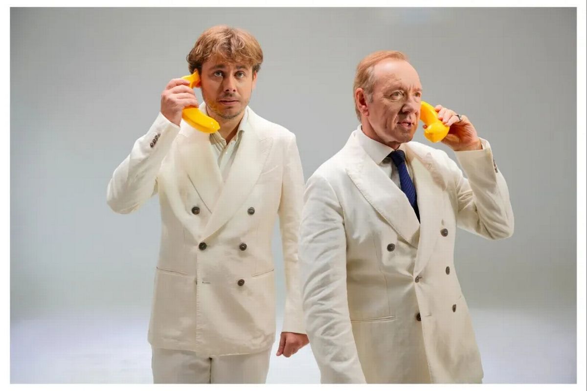 Kevin Spacey and Filippo Laganà wearing white suits