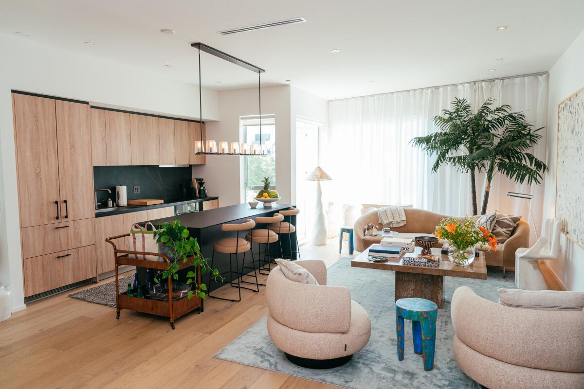 An open living room and kitchen in a condo.