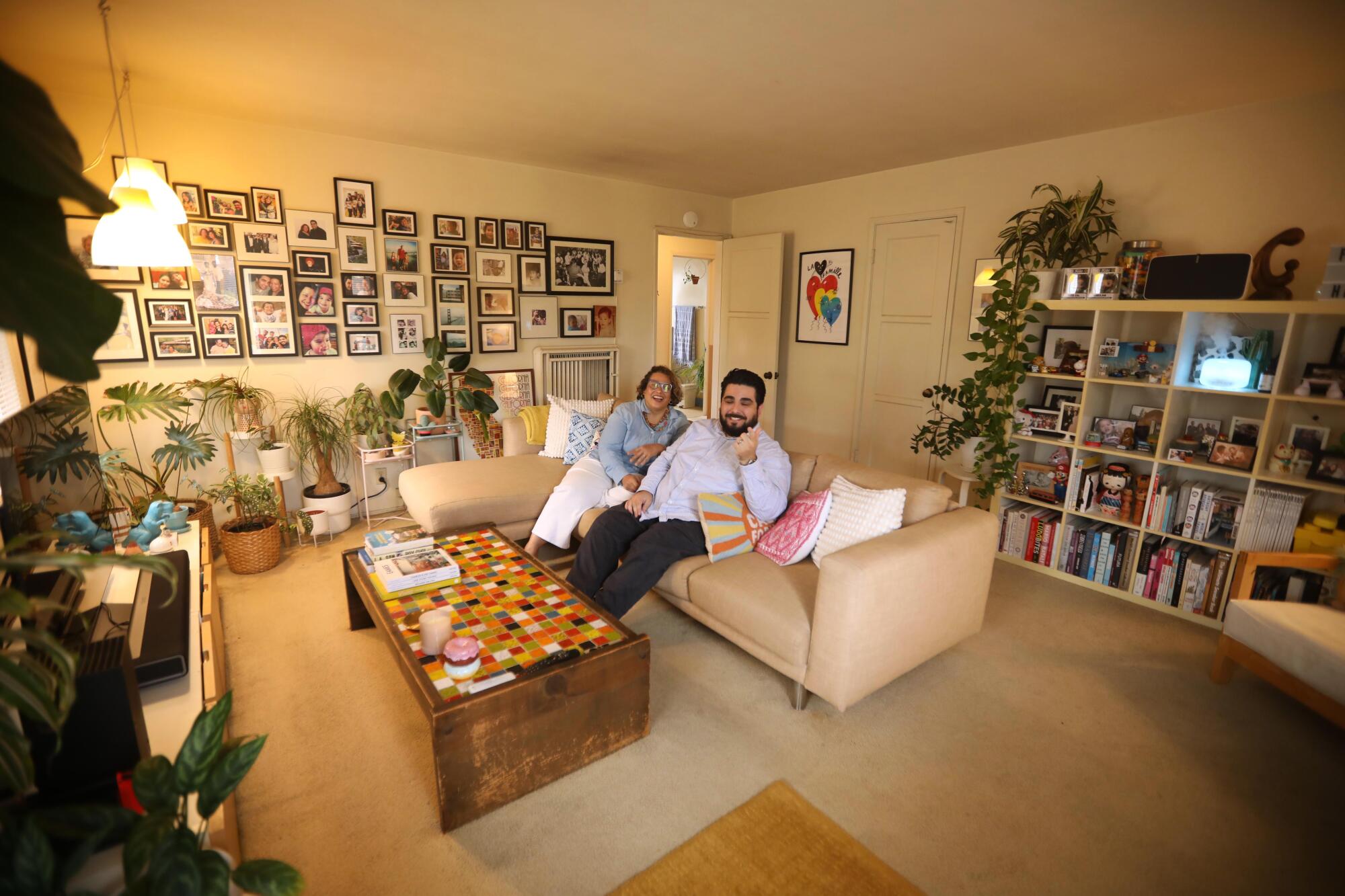 Abraham and Cecilia Beltran enjoy a light moment in their decorated living room.