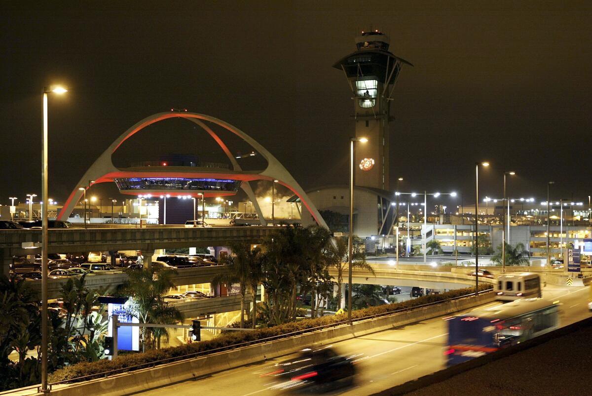  Traffic encircles the Theme building at LAX.