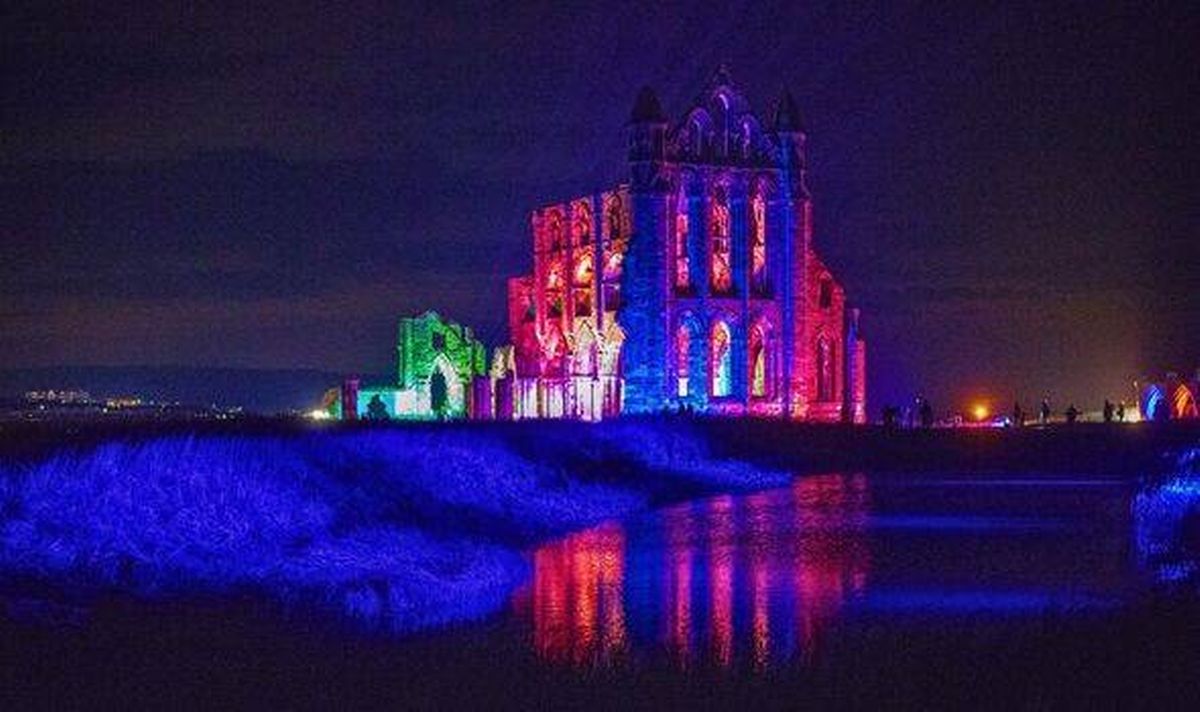 Picture of Whitby Abbey lit up 