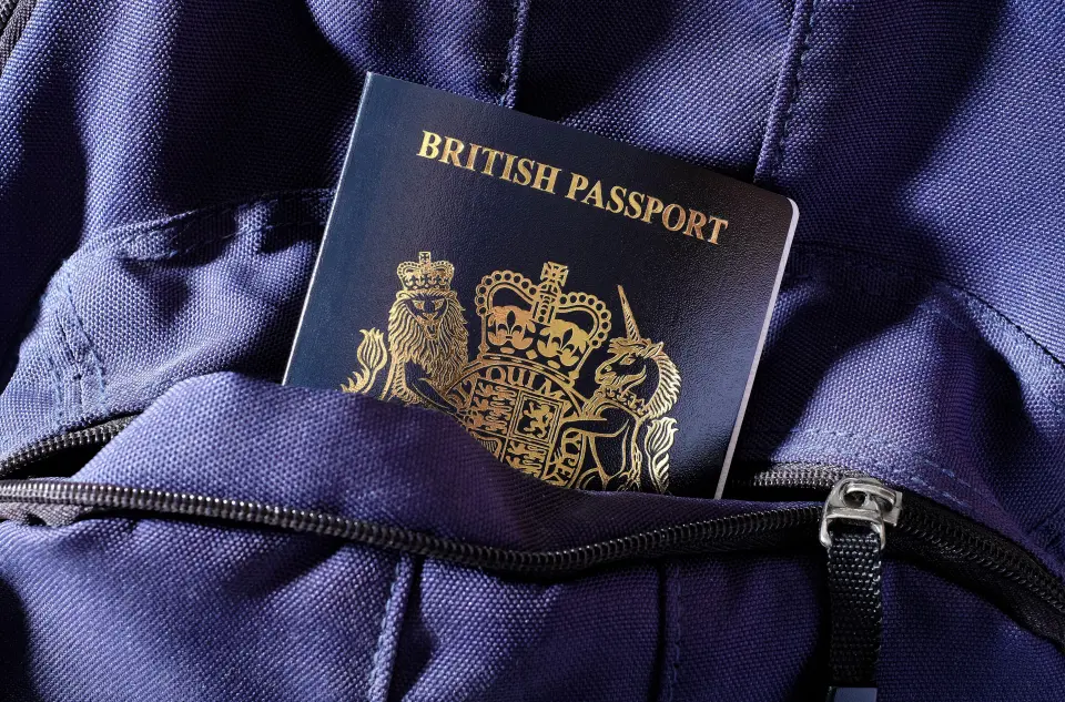A British passport in a blue bag pocket.