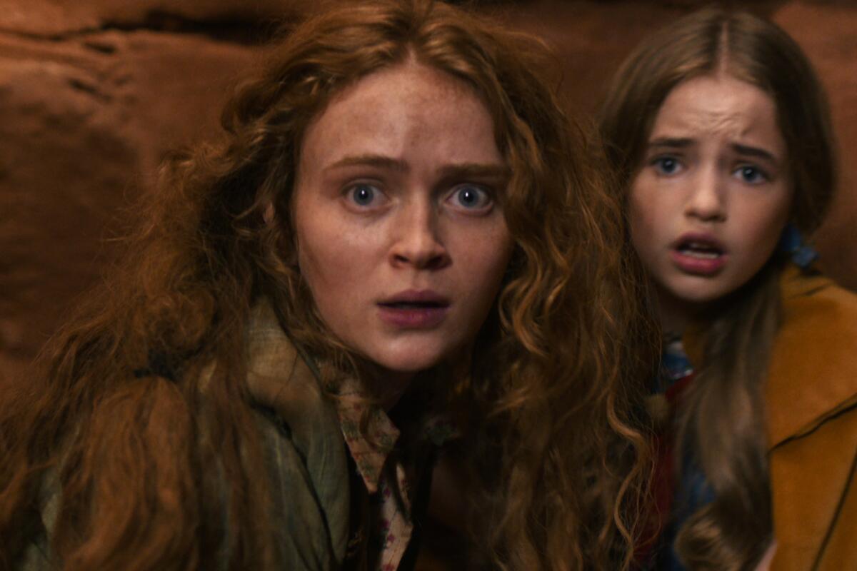 Two girls with scared expressions