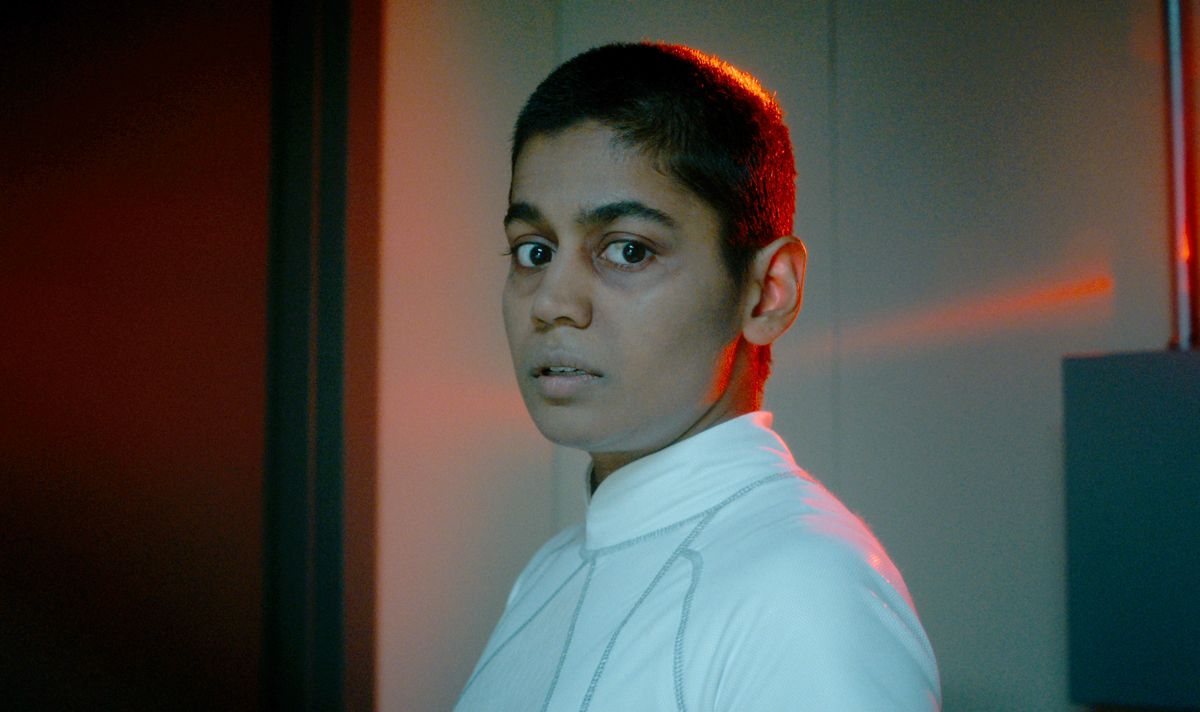 A girl in white looks serious 