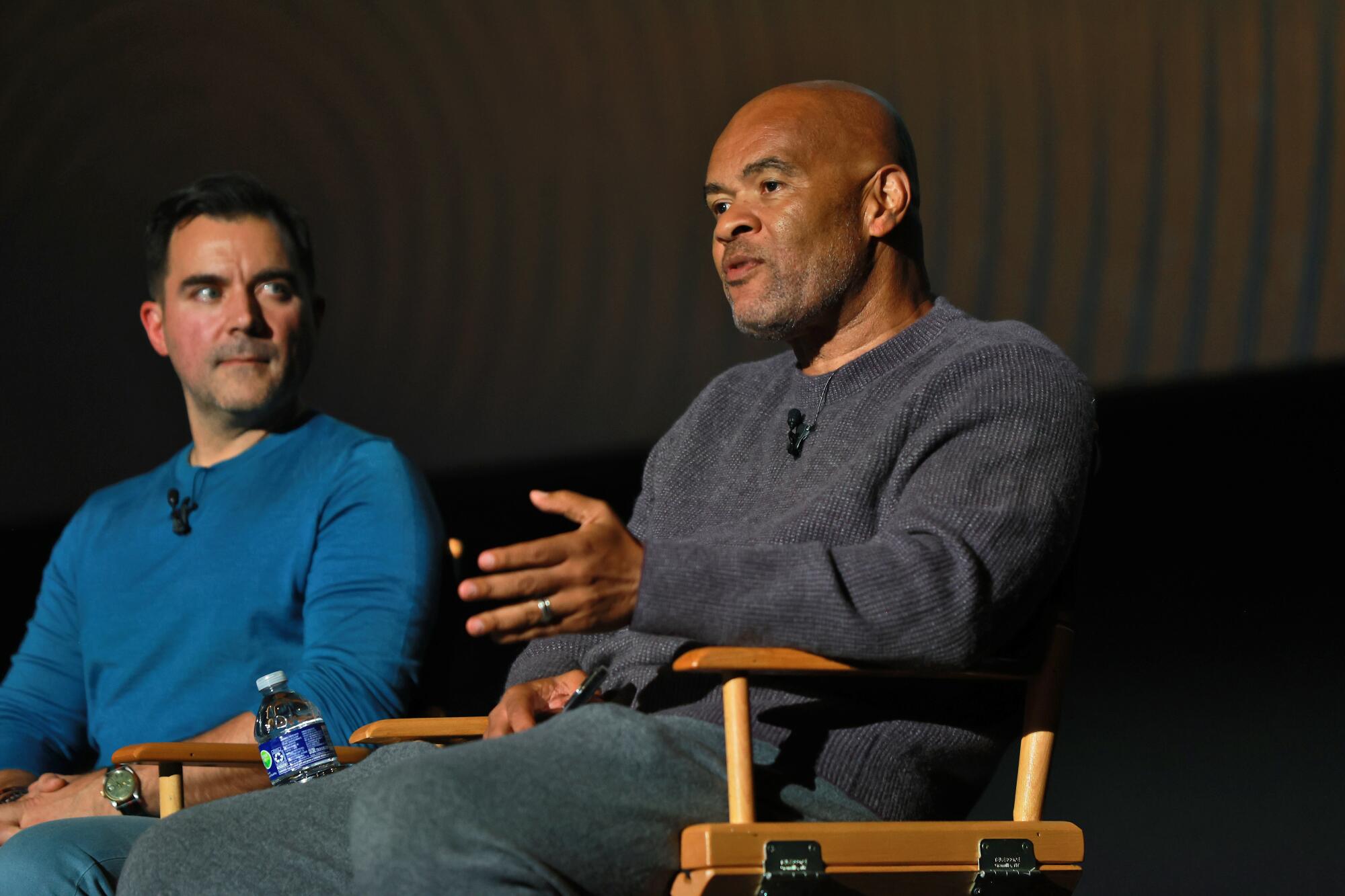 People speak on a panel