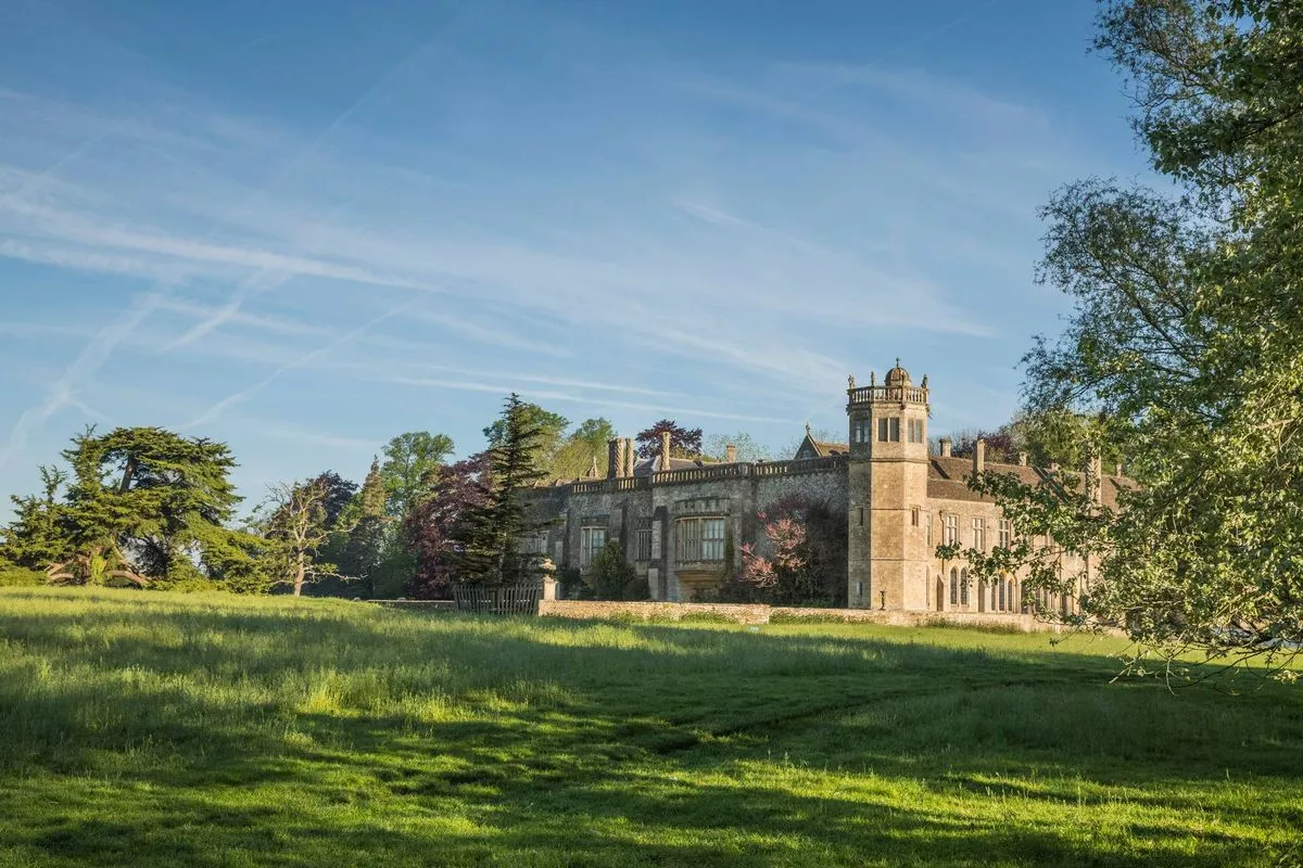 Distant view of the house across the fields at Lacock Abbey