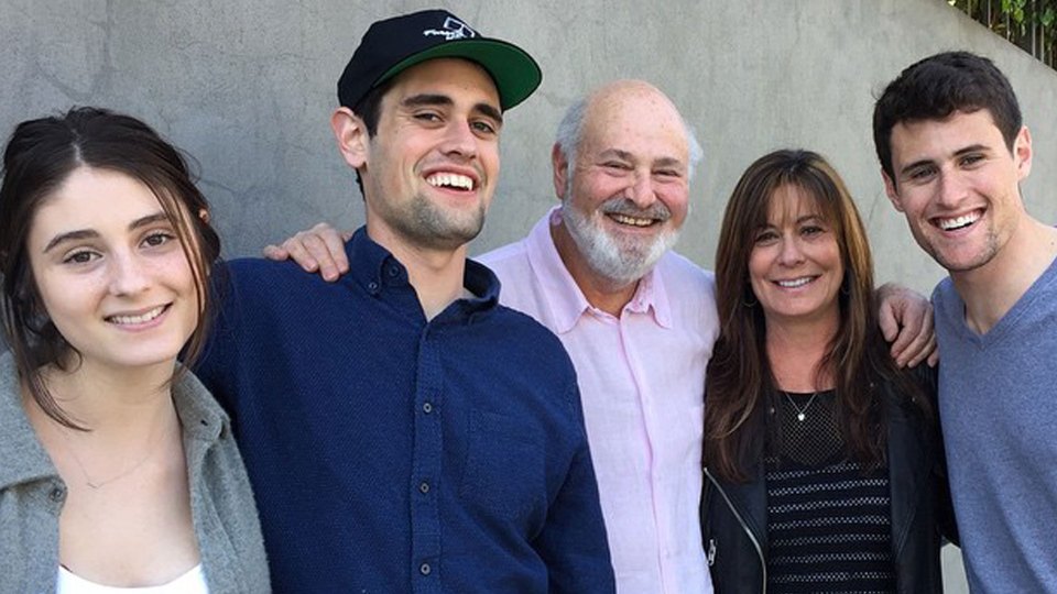 Five members of the Reiner family, including Rob Reiner, smile for a photo.