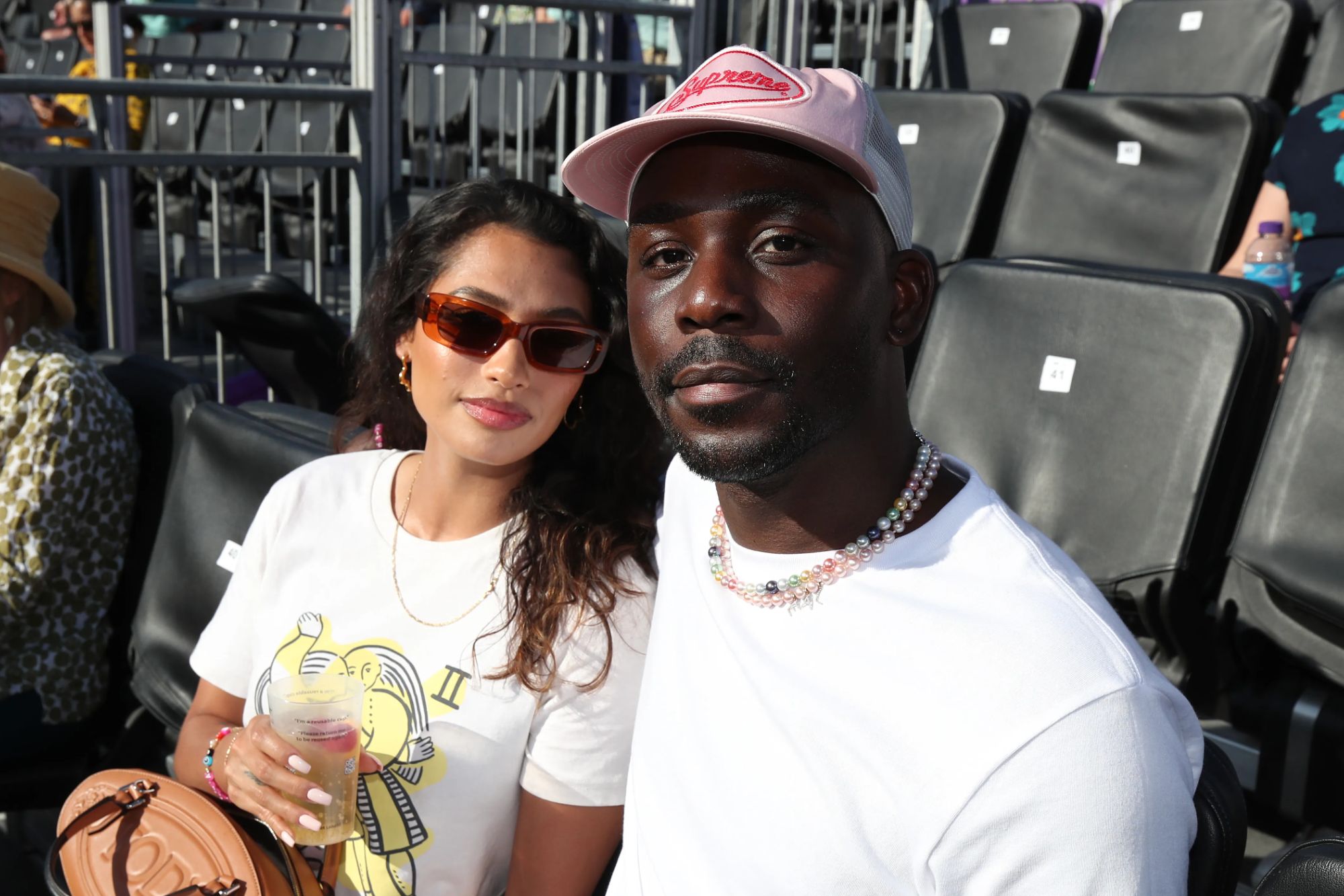 An image collage containing 1 images, Image 1 shows Vanessa White and Emmanuel Lawal enjoying the tennis at the cinch Championships