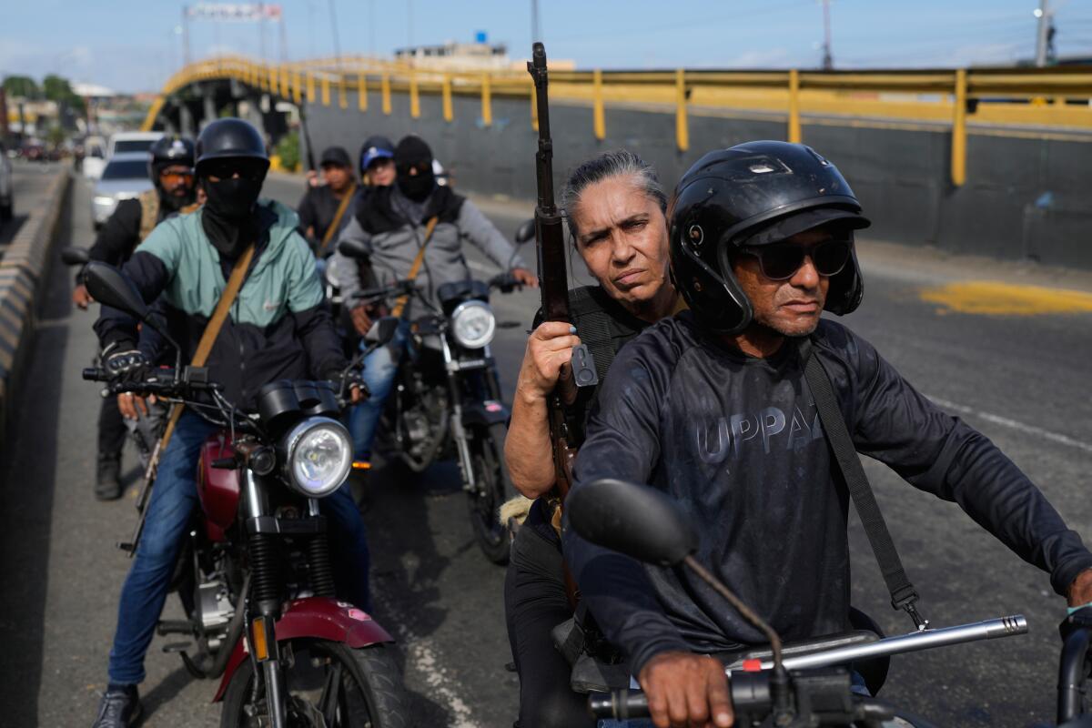Pro-government armed civilians patrol in La Guaira, Venezuela