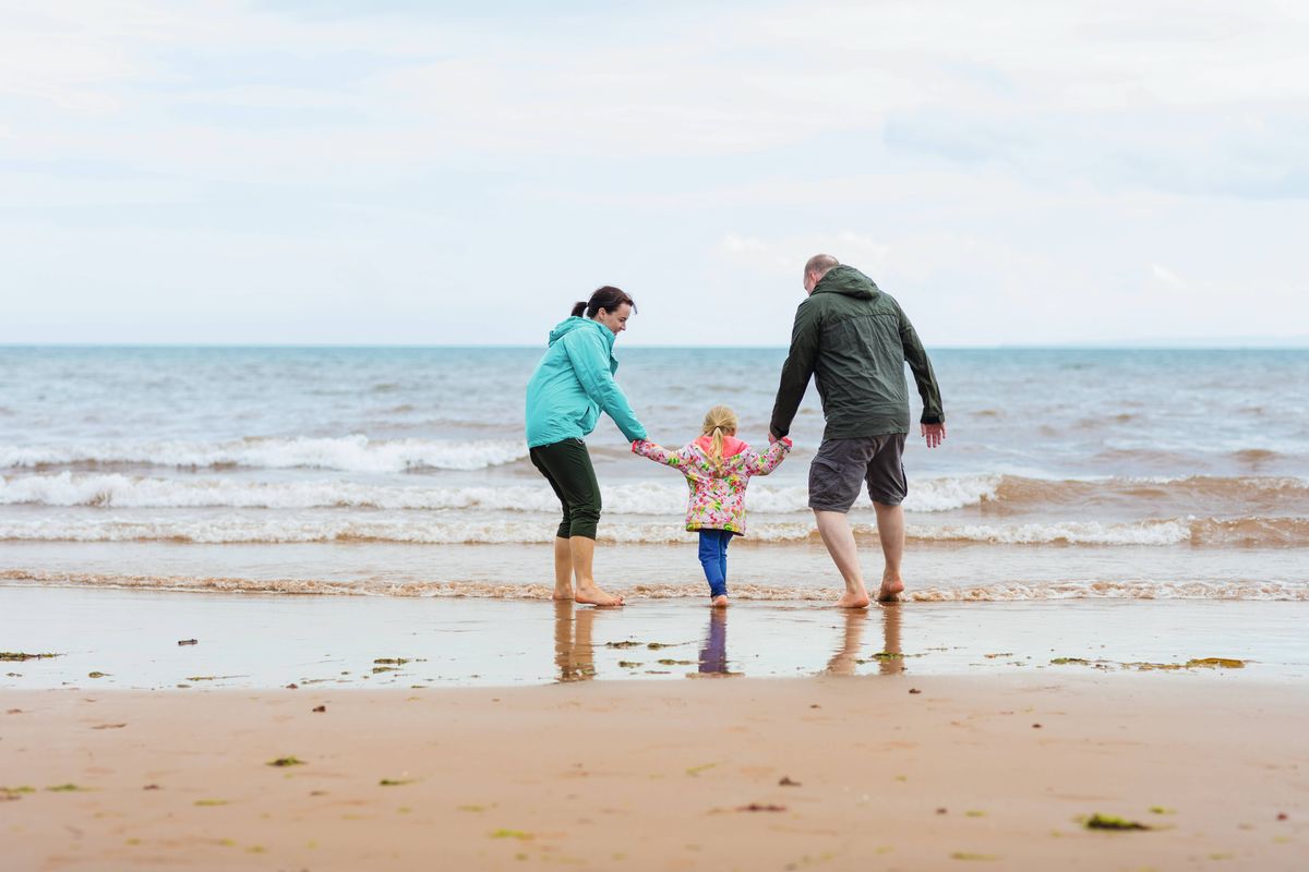 family paddling in the sea