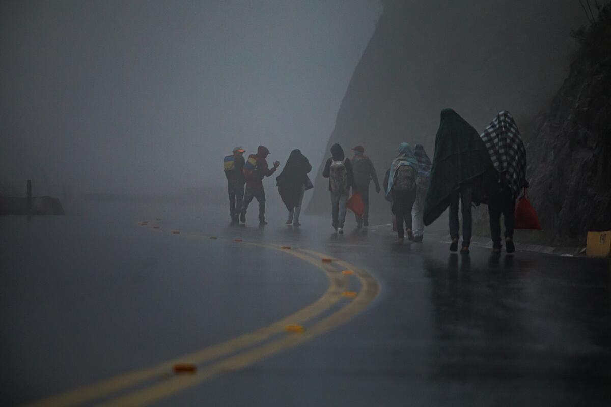 Venezuelans migrants walk toward Bucaramanga, Colombia, in 2019.