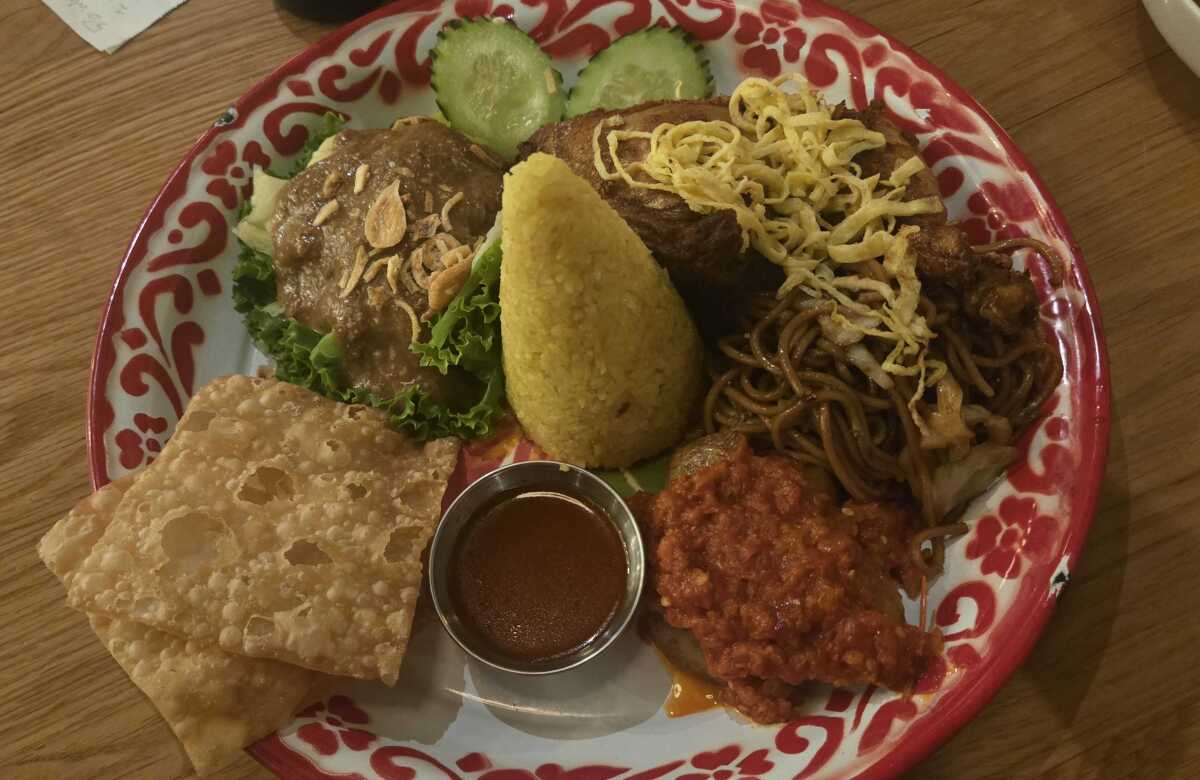 Simpang Asia's festival rice: A platter of turmeric rice, and other food.