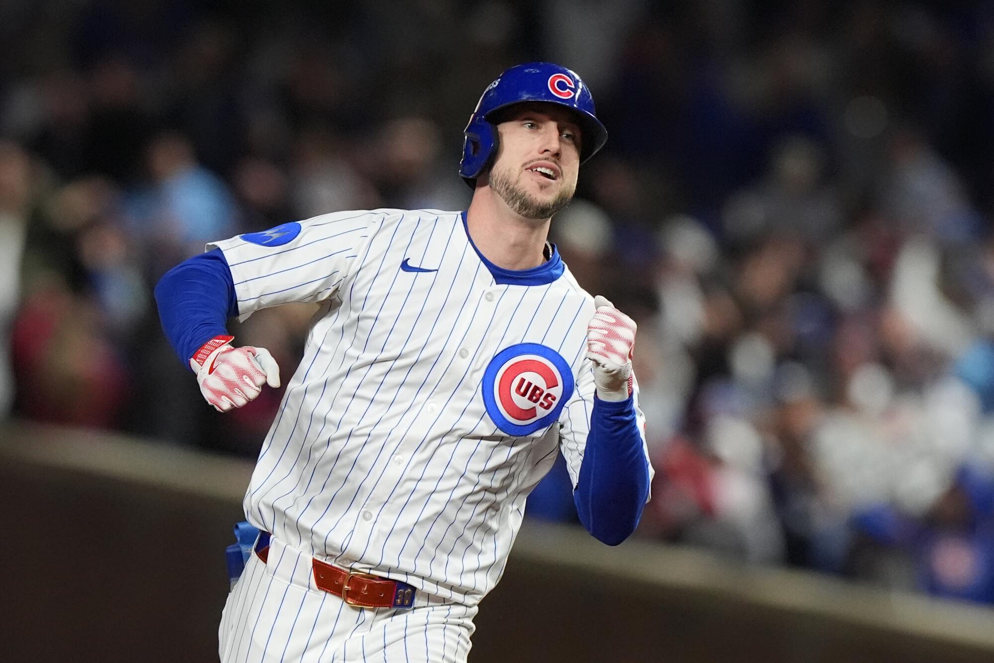 Chicago Cubs' Kyle Tucker runs the bases after hitting a home run