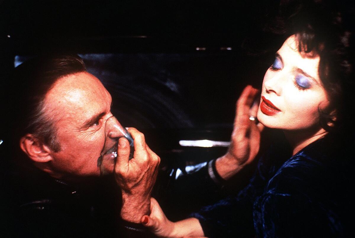 A man inhaling gas makes sexual advances on a woman.