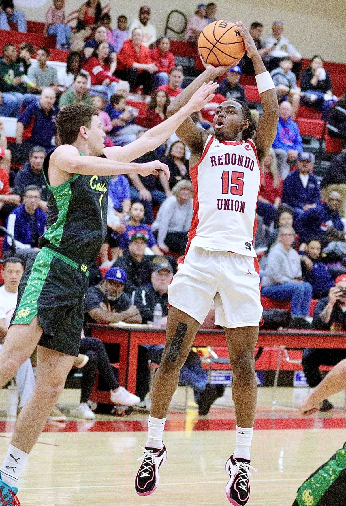 Redondo Union's SJ Madison shoots a jumper during an 85-51 win over Mira Costa on Friday.