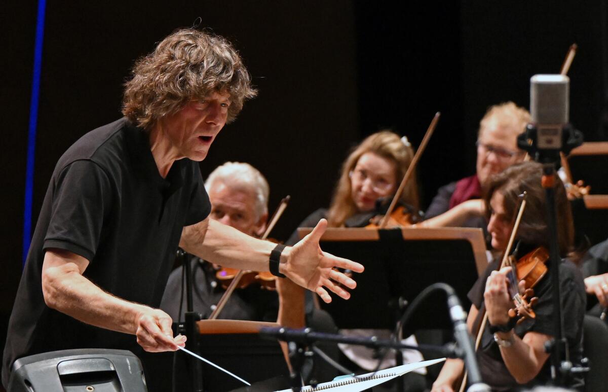 Scott Dunn conducts the Scott Dunn Orchestra in rehearsal. The group performs Saturday night at the Wallis.